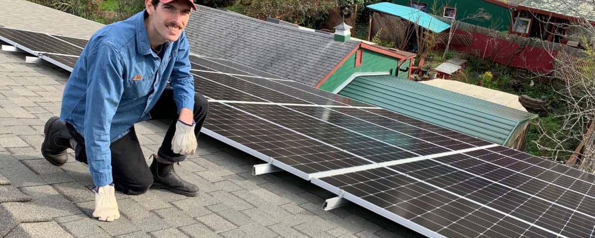 St. Alban’s Episcopal Church’s Ralph Till inspects the solar panels at the church. (St. Alban’s — Contributed)