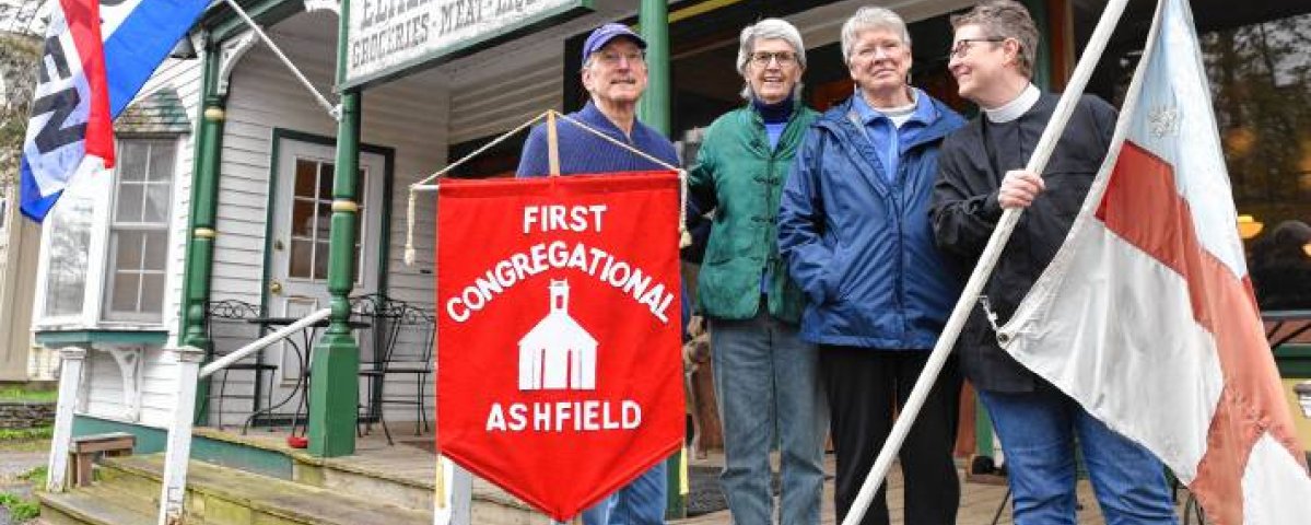 Leaders from First Church and St. John's on the steps of Elmer's (Courtesy: Greenfield Recorder)