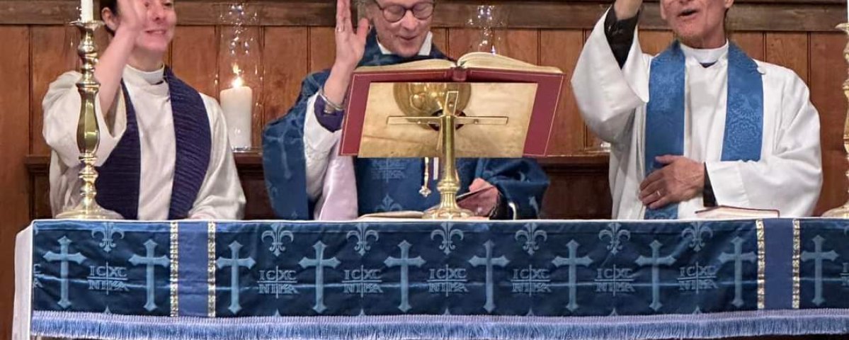 The Priest Associate team of Rev. Rachel Field, Rev. Canon Lee Crawford and Rev. Earl Kooperkamp blesses the congregation during the celebration of new ministry.