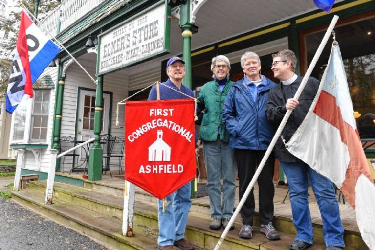 Leaders from First Church and St. John's on the steps of Elmer's (Courtesy: Greenfield Recorder)