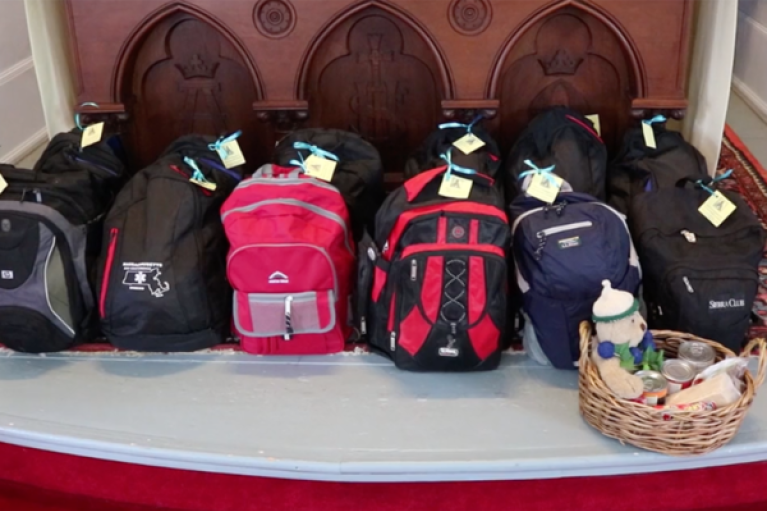 Backpacks placed at the foot of the altar for the community's blessing (Photo: St. John's, Ashfield)