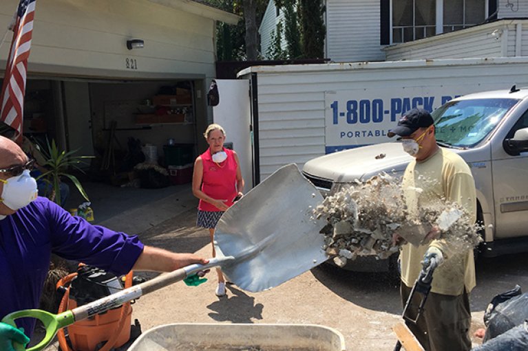 Bishop and communities members assist in community clean up after Hurricane damage