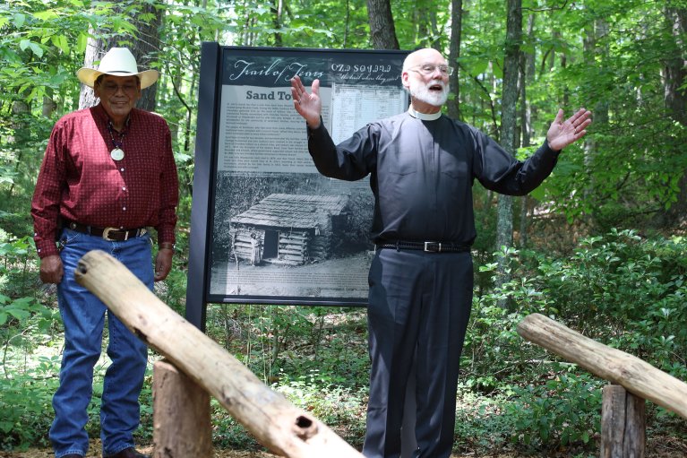 The Rev. Carl Southerland speaks after revealing the Sand Town sign. 