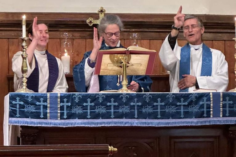 The Priest Associate team of Rev. Rachel Field, Rev. Canon Lee Crawford and Rev. Earl Kooperkamp blesses the congregation during the celebration of new ministry.