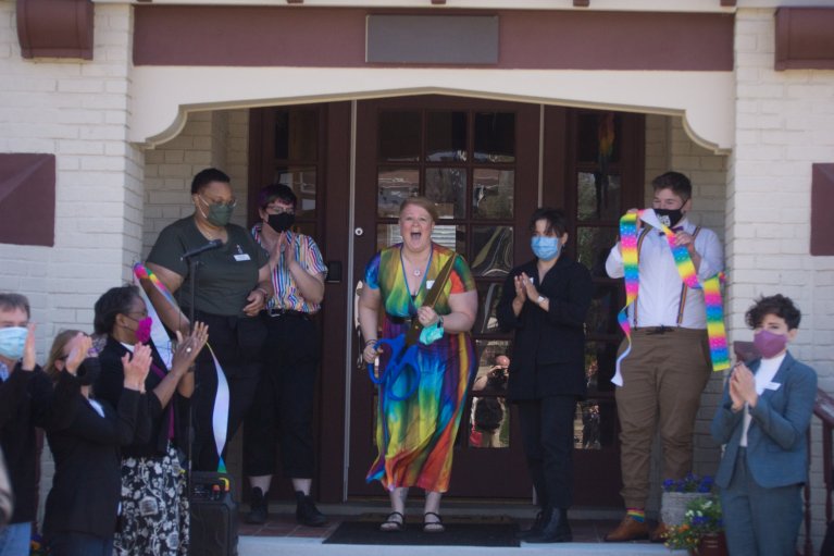 Trinity Haven Executive Director Jenni White expresses joy after the ribbon-cutting ceremony to open the first transitional housing program for LGBTQ+ young people in Indiana.