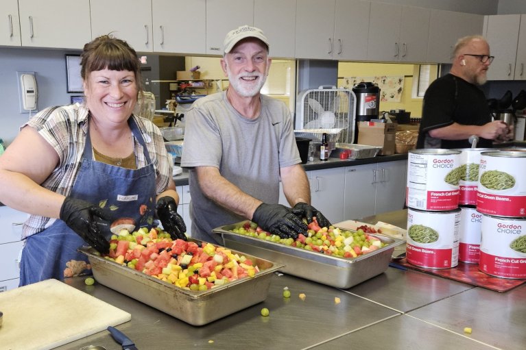Volunteers prepare a meal in St. Stephen's kitchen