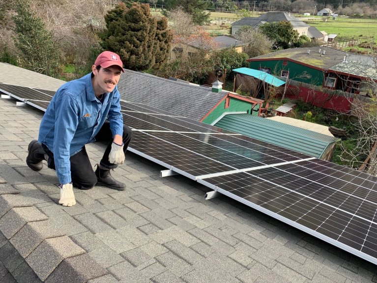 St. Alban’s Episcopal Church’s Ralph Till inspects the solar panels at the church. (St. Alban’s — Contributed)