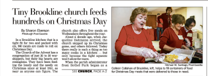 Volunteers help to fill containers of food for Christmas dinner
