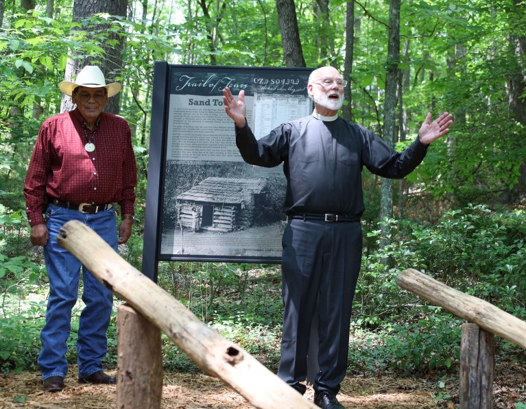 The Rev. Carl Southerland speaks after revealing the Sand Town sign. 