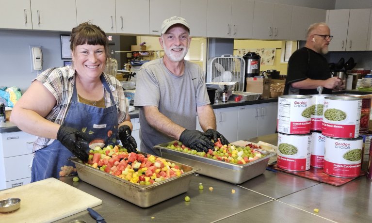 Volunteers prepare a meal in St. Stephen's kitchen